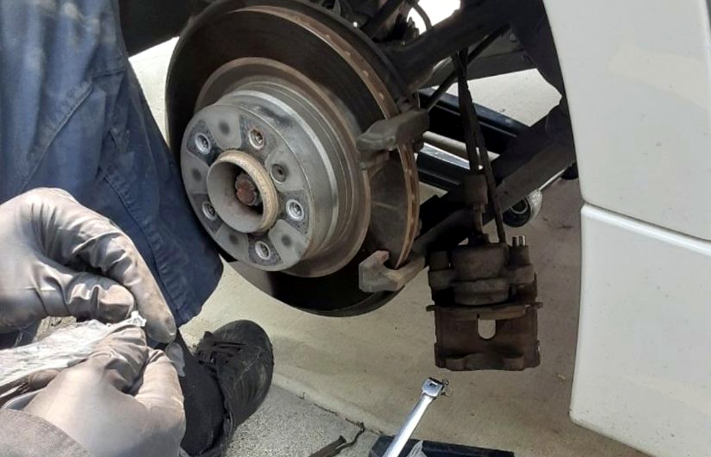 Mechanic replacing air filter on a truck near Wolfforth Texas