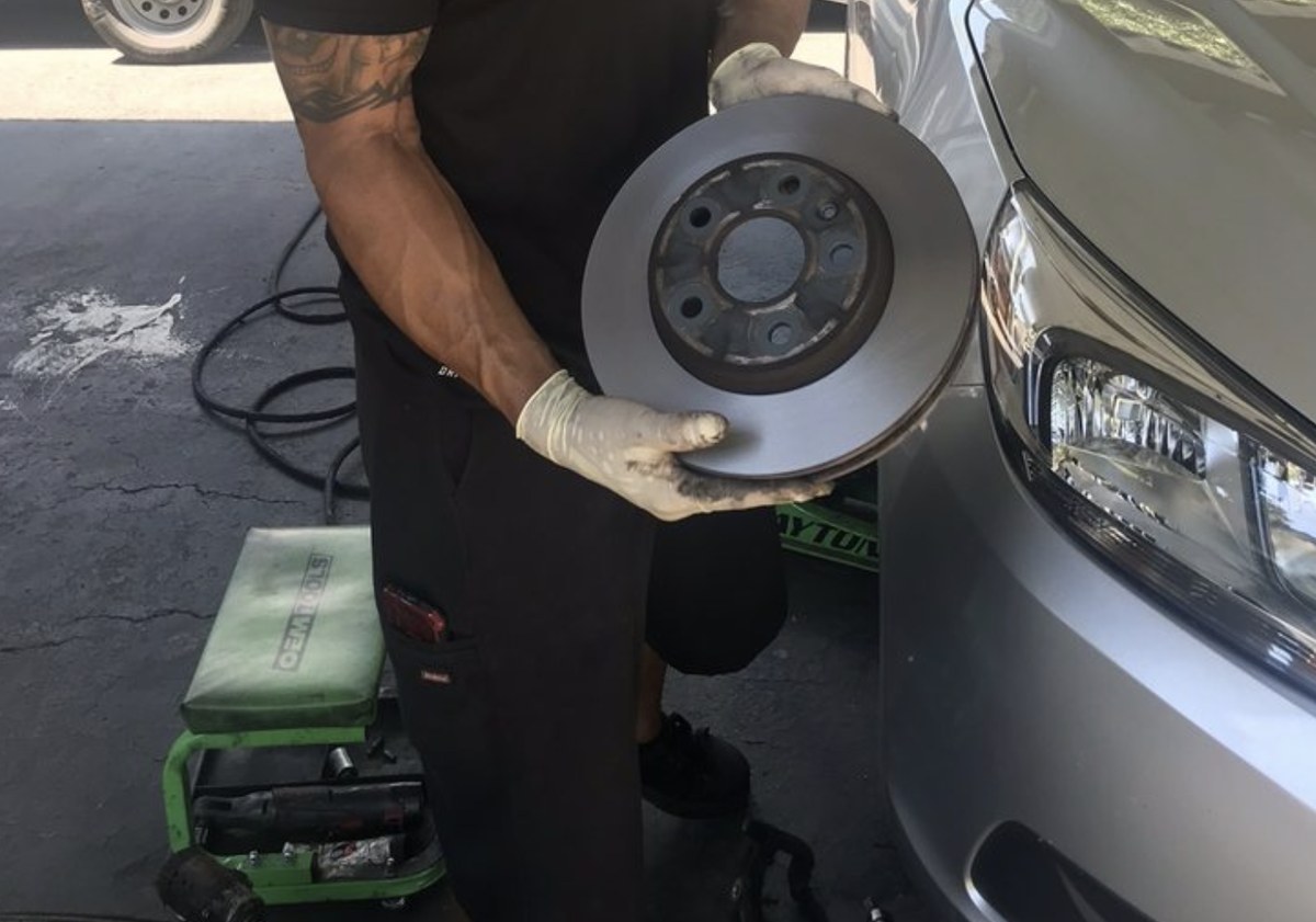 New rotor in hand at a Lubbock driveway brake job